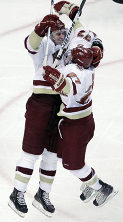 BC wins 2011 Beanpot : Jimmy Hayes celebrates his OT goal with teammate Patch Alber. AP photo